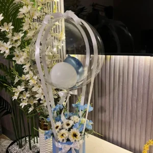 WhatsApp Image 2026-07-12 at 3.07.15 PM (1) The Enchanted Hot Air Balloon Floral Box (Blue & White)